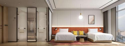 Imagen de la habitación del Hotel Hilton Garden Inn Kunming Dianchi. Foto 13