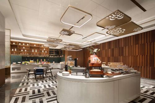 Imagen del bar/restaurante del Hotel Hilton Garden Inn Luoyang Kaiyuan Avenue. Foto 2