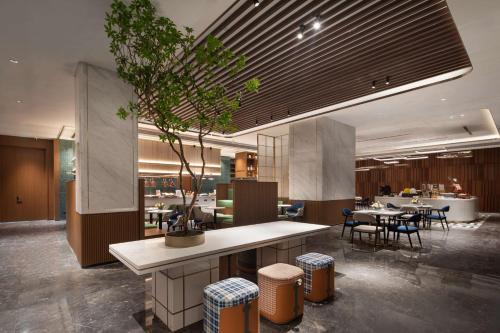 Imagen del bar/restaurante del Hotel Hilton Garden Inn Luoyang Kaiyuan Avenue. Foto 3