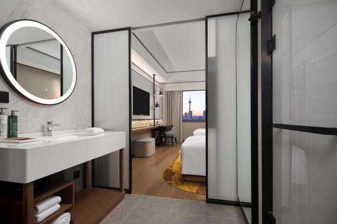 Imagen de la habitación del Hotel Hilton Garden Inn Tianjin Five Great Avenues. Foto 10