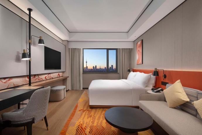 Imagen de la habitación del Hotel Hilton Garden Inn Tianjin Five Great Avenues. Foto 11