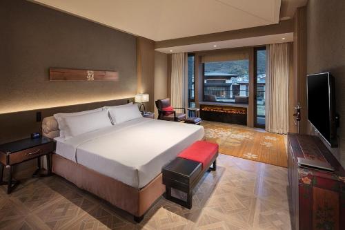 Imagen de la habitación del Hotel Hilton Jiuzhaigou Resort. Foto 7