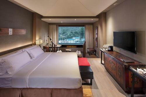 Imagen de la habitación del Hotel Hilton Jiuzhaigou Resort. Foto 9