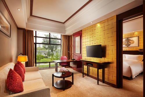 Imagen de la habitación del Hotel Hilton Tianjin Eco City. Foto 11