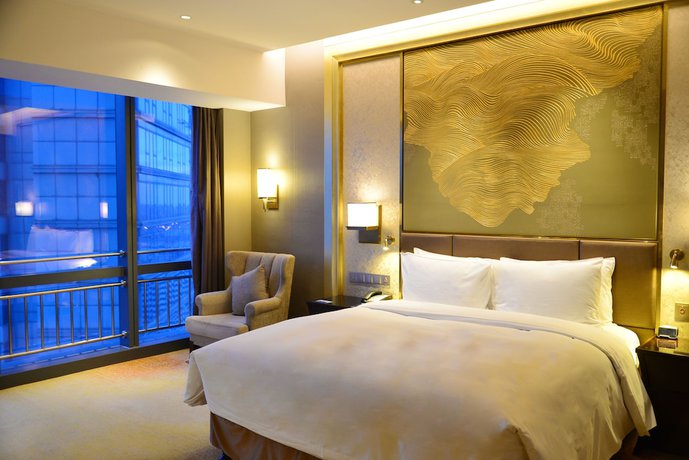 Imagen de la habitación del Hotel Hilton Yantai. Foto 15