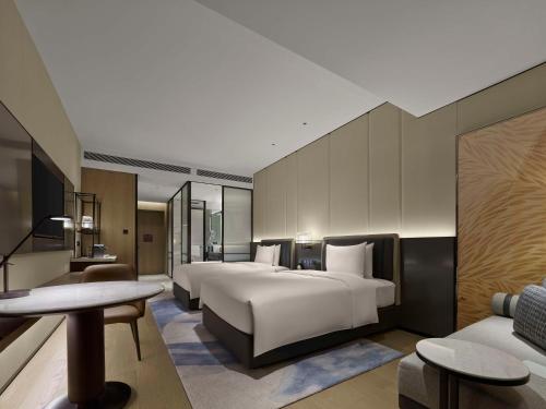 Imagen de la habitación del Hotel Hilton Yuyao. Foto 17