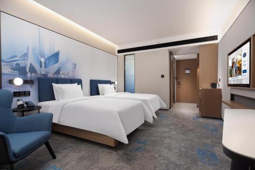 Imagen de la habitación del Hotel Hilton by Hampton Guangzhou Xintang. Foto 13