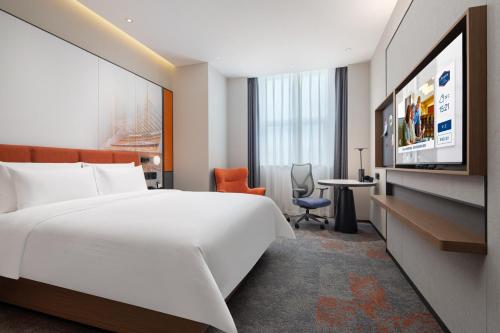 Imagen de la habitación del Hotel Hilton by Hampton Guangzhou Xintang. Foto 16