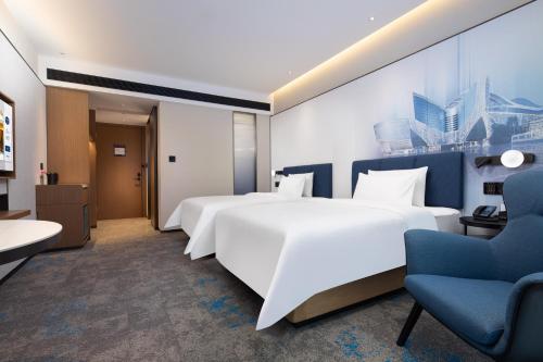 Imagen de la habitación del Hotel Hilton by Hampton Guangzhou Xintang. Foto 17