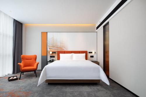 Imagen de la habitación del Hotel Hilton by Hampton Guangzhou Xintang. Foto 19