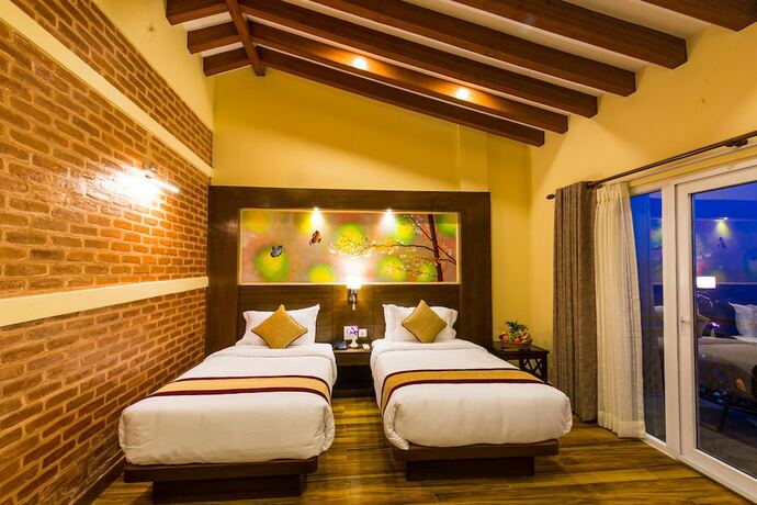 Imagen de la habitación del Hotel Himalaya Drishya Resort. Foto 18