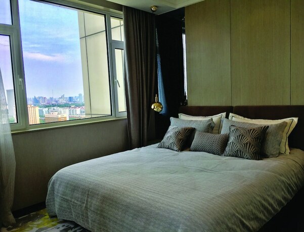 Imagen de la habitación del Hotel Himalaya Serviced Residences Nankai Tianjin. Foto 16