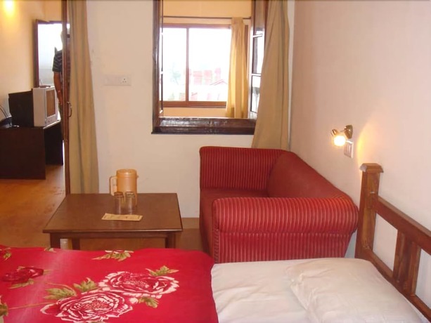 Imagen de la habitación del Hotel Himalayan Club. Foto 19