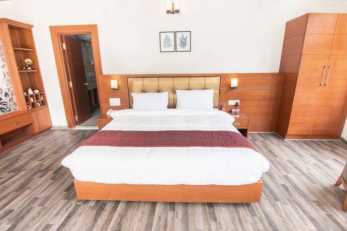 Imagen de la habitación del Hotel Himalayan Splendour Resort. Foto 15