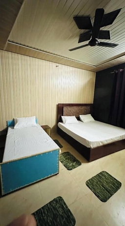 Imagen de la habitación del Hotel Himvant residency. Foto 9