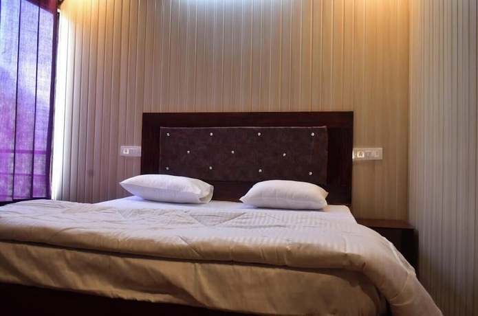 Imagen de la habitación del Hotel Himvant residency. Foto 10