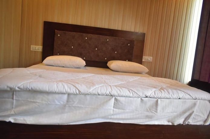 Imagen de la habitación del Hotel Himvant residency. Foto 12
