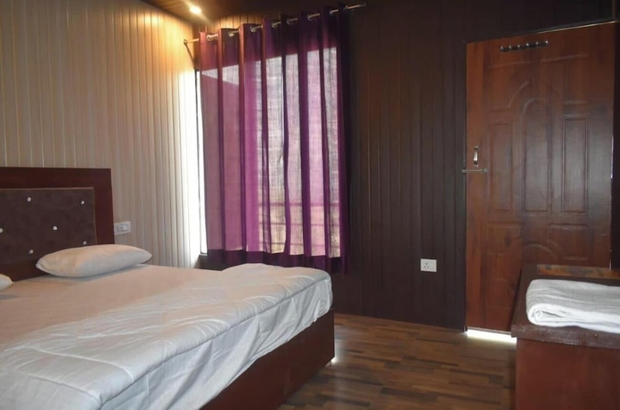 Imagen de la habitación del Hotel Himvant residency. Foto 13