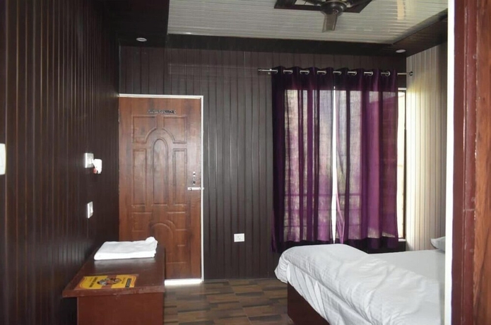 Imagen de la habitación del Hotel Himvant residency. Foto 15