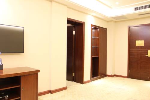 Imagen de la habitación del Hotel Hit Business Harbin. Foto 11