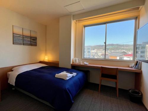 Imagen de la habitación del Hotel Hitachi Crane. Foto 11