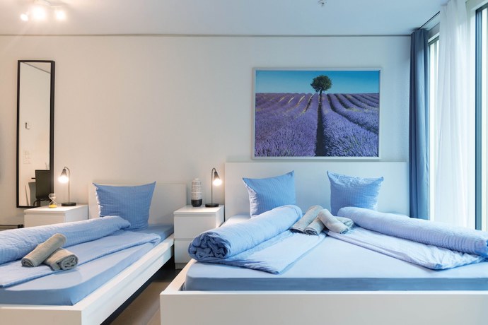 Imagen de la habitación del Hotel Hitrental Allmend Comfort Apartments. Foto 12