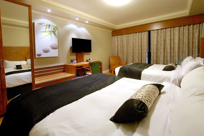 Imagen de la habitación del Hotel H&ocirc;tel And Suites Le Dauphin Drummondville. Foto 6