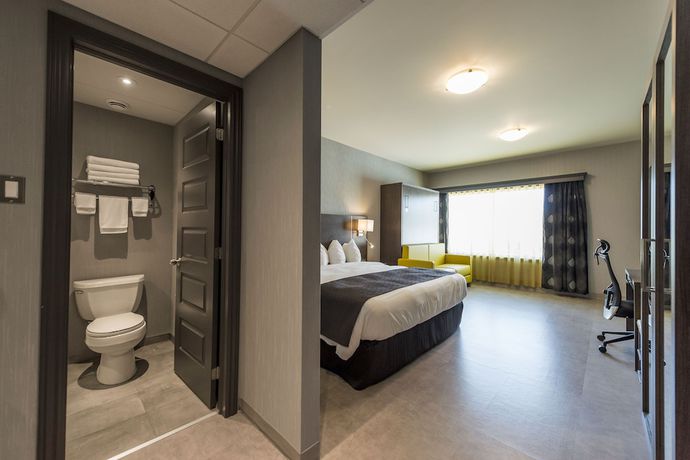 Imagen de la habitación del Hotel H&ocirc;tel And Suites Le Dauphin Drummondville. Foto 7