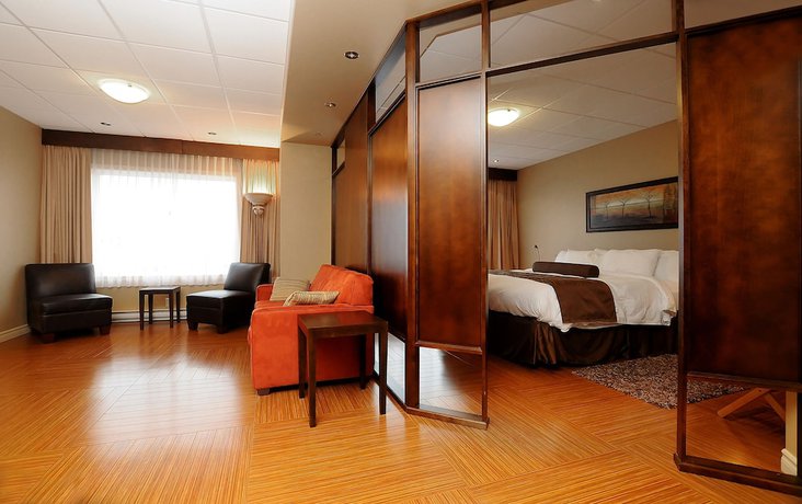 Imagen de la habitación del Hotel H&ocirc;tel And Suites Le Dauphin Drummondville. Foto 13