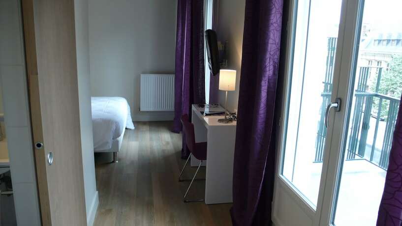 Imagen de la habitación del Hotel Hôtel Cardinal. Foto 13