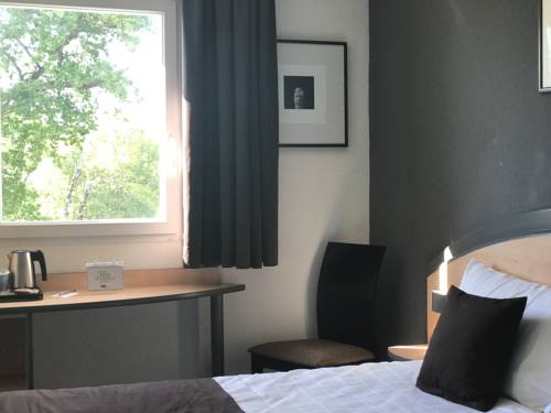 Imagen de la habitación del Hotel Hôtel Kyriad Brive Ouest. Foto 3