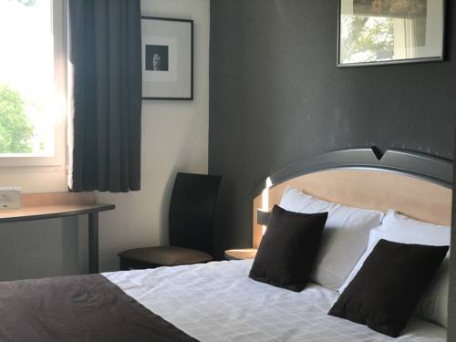 Imagen de la habitación del Hotel Hôtel Kyriad Brive Ouest. Foto 7