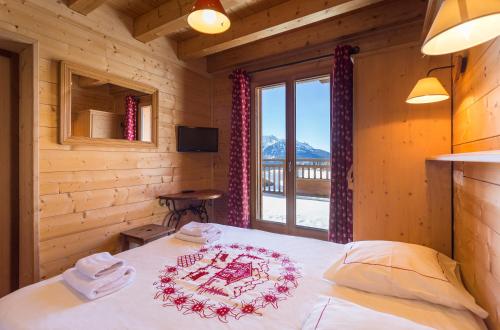 Imagen de la habitación del Hotel H&ocirc;tel L\'Accroche Coeur. Foto 6