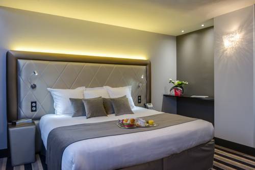 Imagen de la habitación del Hotel Hôtel Le Châteaubriant. Foto 1