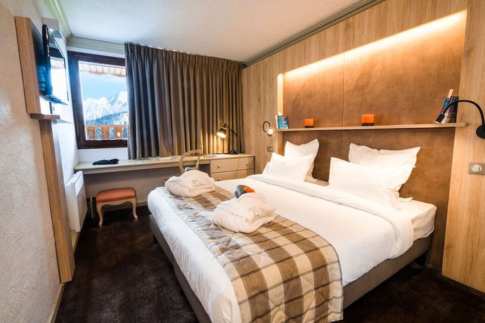 Imagen de la habitación del Hotel Hôtel Le Courcheneige. Foto 11