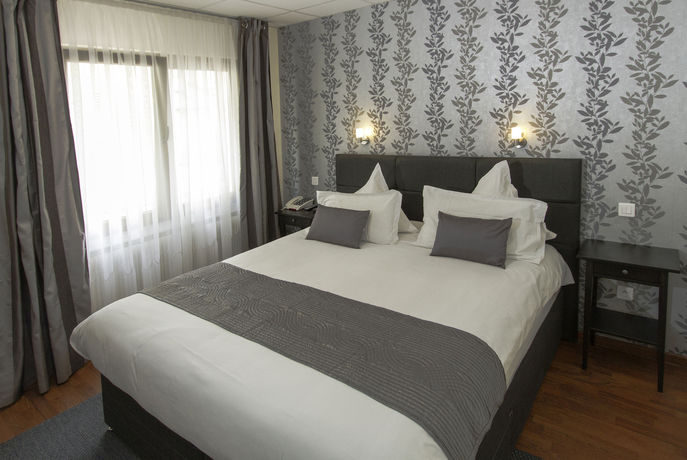 Imagen de la habitación del Hotel Hôtel Le Divona. Foto 3