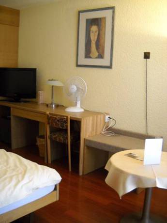 Imagen de la habitación del Hotel H&ocirc;tel Le National, Del&eacute;mont. Foto 4
