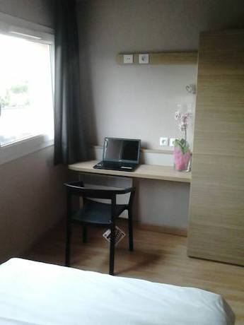 Imagen de la habitación del Hotel Hôtel L'eolienne. Foto 12