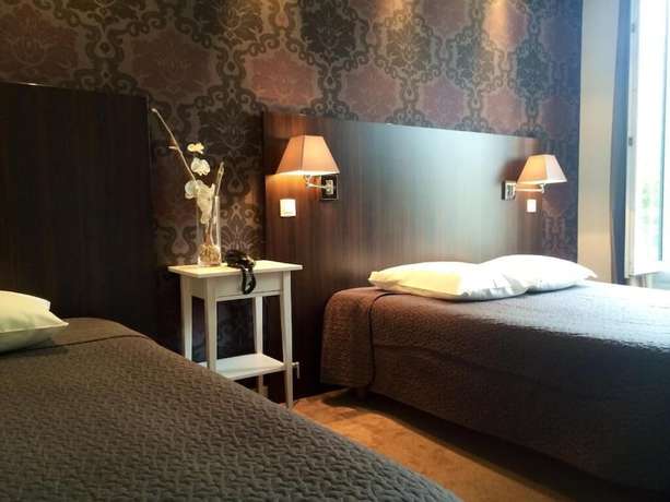 Imagen de la habitación del Hotel H&ocirc;tel Les Negociants. Foto 11