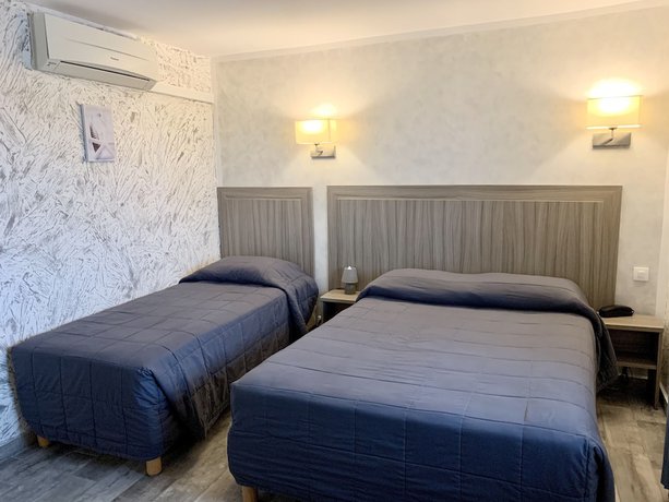 Imagen de la habitación del Hotel Hôtel Les Palmiers en Camargue. Foto 5