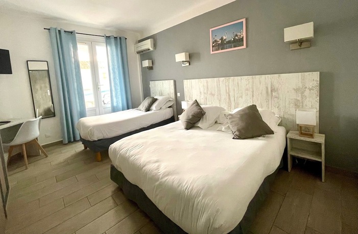 Imagen de la habitación del Hotel Hôtel Les Palmiers en Camargue. Foto 10