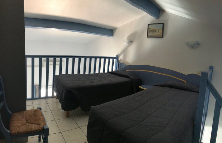 Imagen de la habitación del Hotel Hôtel Les Palmiers en Camargue. Foto 12