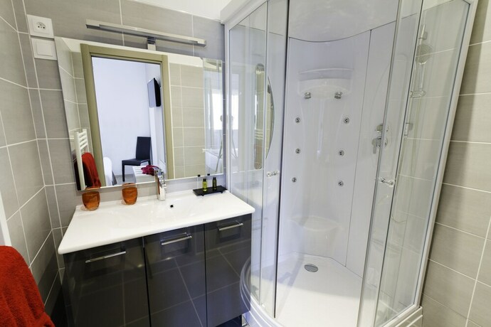 Imagen de la habitación del Hotel H&ocirc;tel Les Petits Oreillers. Foto 13