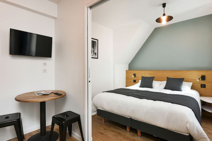 Imagen de la habitación del Hotel H&ocirc;tel R&eacute;sidence Montebello. Foto 13