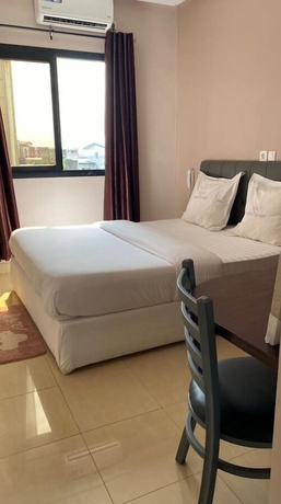 Imagen de la habitación del Hotel H&ocirc;tel TOMEDI. Foto 9