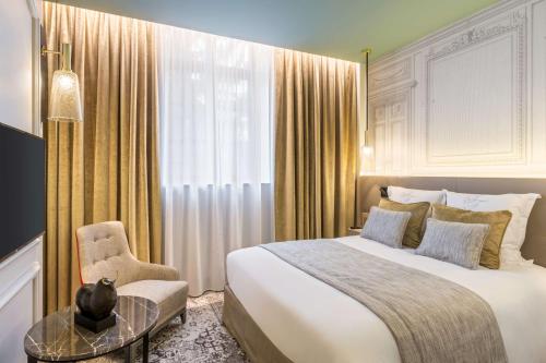 Imagen de la habitación del Hotel H&ocirc;tel & Spa Les Sept Fontaines Best Western Premier. Foto 4