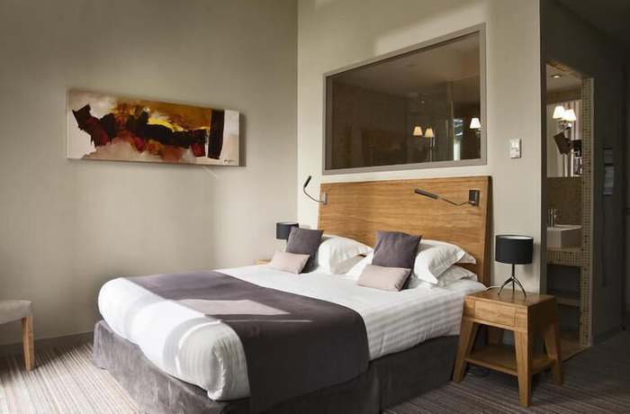 Imagen de la habitación del Hotel Hôtel and Spa du Château. Foto 18