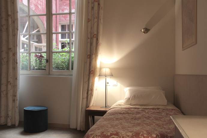 Imagen de la habitación del Hotel H&ocirc;tel de l\'Amphith&eacute;&acirc;tre. Foto 3