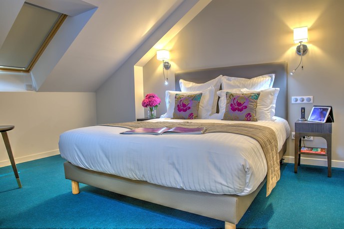 Imagen de la habitación del Hotel Hôtel de la Tabletterie. Foto 11