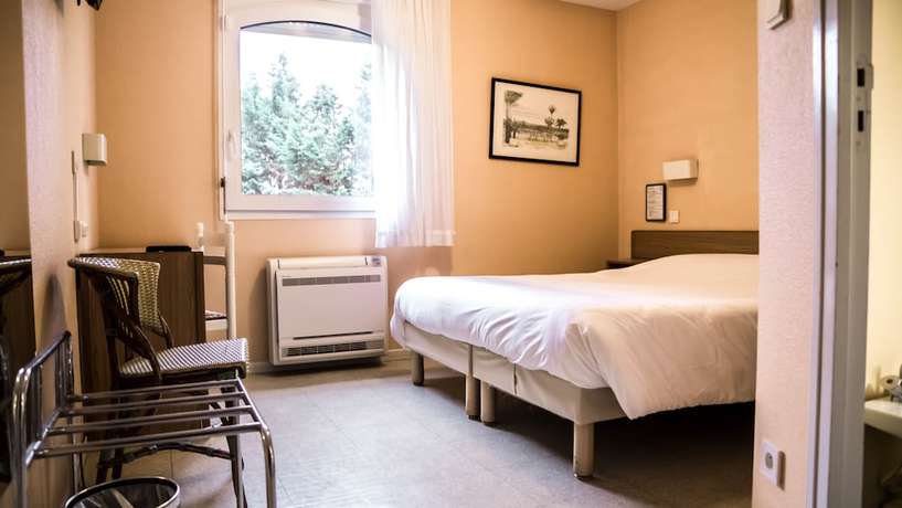 Imagen de la habitación del Hotel H&ocirc;tel du Canal. Foto 8